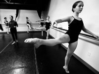 Natalie Nilson, 15, and fellow E class students, perform Developpe stances during barre exercises at the New Bedford Ballet studio on Purchast Street in the north end of New Bedford.   [ PETER PEREIRA/THE STANDARD-TIMES/SCMG ]